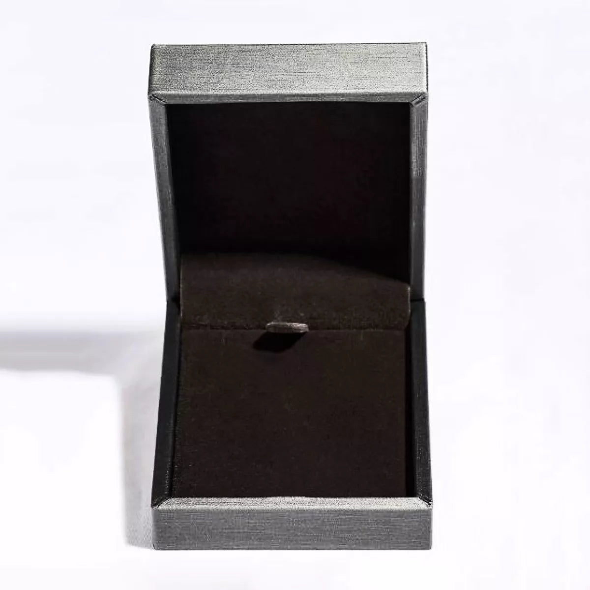 Black ring box with a silver rim on a white background