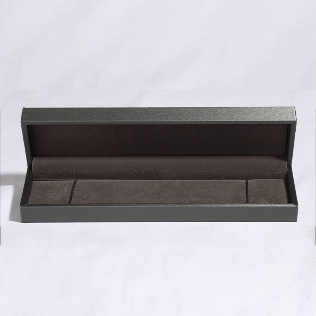Open gray jewelry box on a white background
