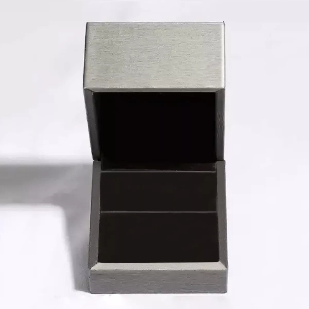 Metallic gray rectangular box with a lid on a white background