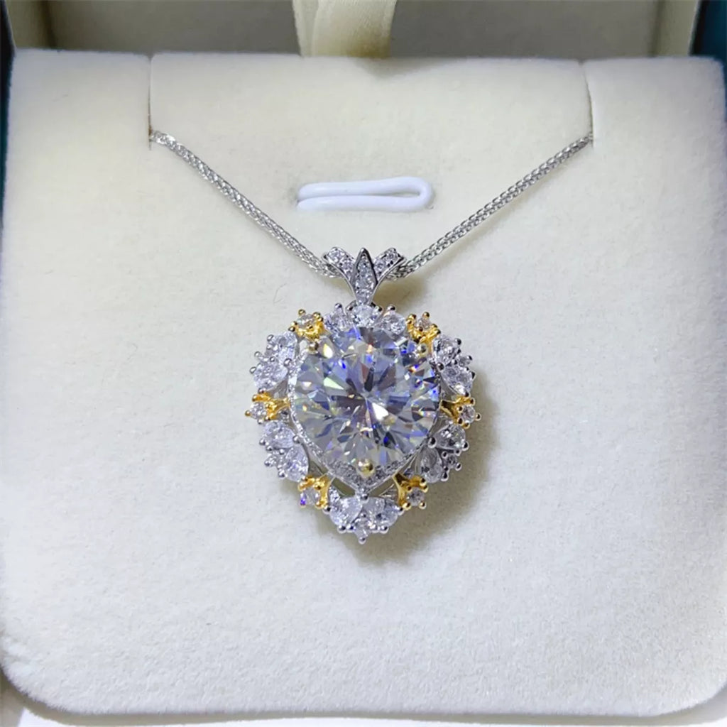Diamond necklace with a heart-shaped pendant on a white cushion