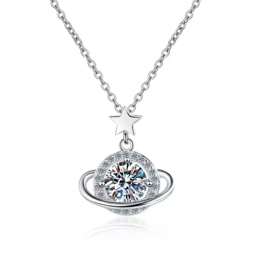 Silver necklace with a star and circular pendant on a white background