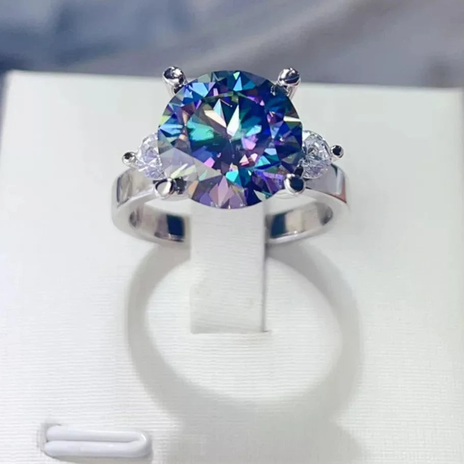 5ct blue moissanite diamond Ring with a colorful gemstone on a white stand