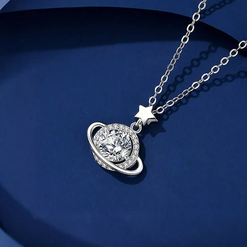 Silver necklace with a heart-shaped pendant and star charm on a blue background